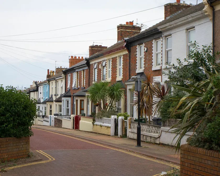 Brick terraced homes along a quiet residential street in Liverpool